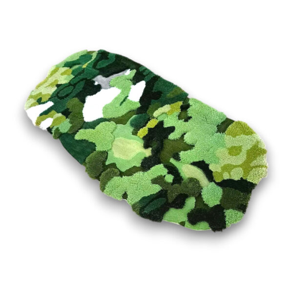 Custom hand-tufted oval wool moss rug in green camouflage pattern with white accents