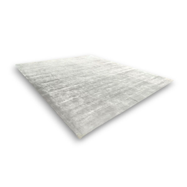 Custom hand-tufted rectangular bamboo silk rug in light gray with subtle textured pattern and natural sheen