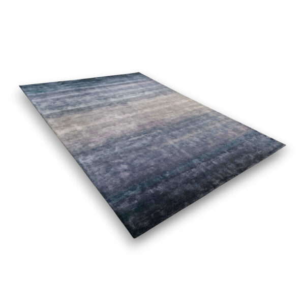 Custom hand-tufted rectangular bamboo silk rug with blue-gray gradient pattern fading from dark navy at bottom to light cream at top