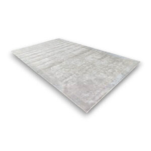 Custom hand-tufted rectangular rayon rug in light gray with subtle textured pattern and visible border