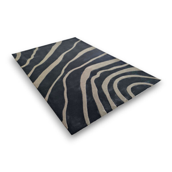 Custom hand-tufted rectangular rug in black with flowing cream curved stripes in an organic wave pattern