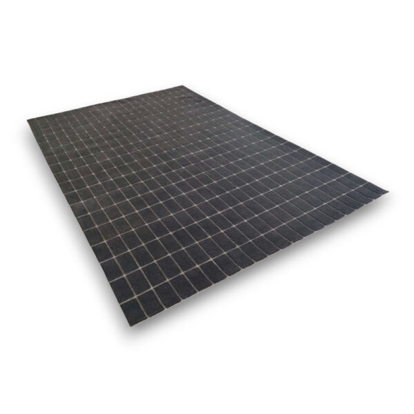 Custom hand-tufted rectangular rug in black with white grid pattern creating uniform squares