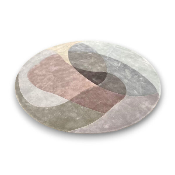 Custom hand-tufted round bamboo silk rug with geometric interlocking pattern in pink, gray, green and cream color blocks