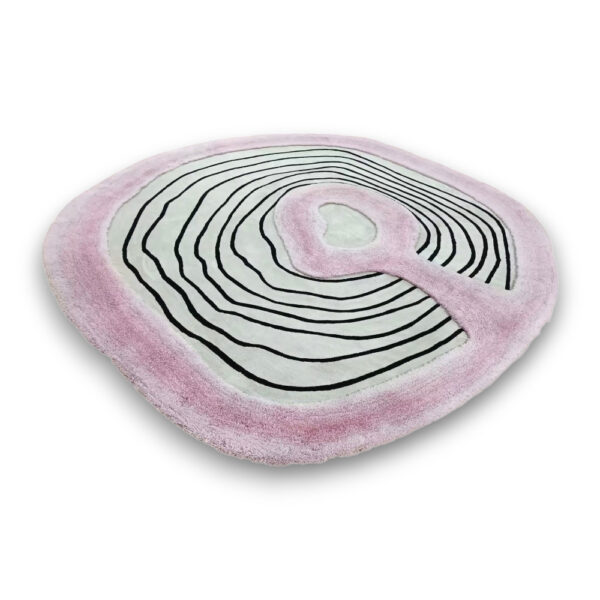 Custom hand-tufted shaggy wool rug in organic teardrop shape with pink border and black linear topographic pattern on cream center
