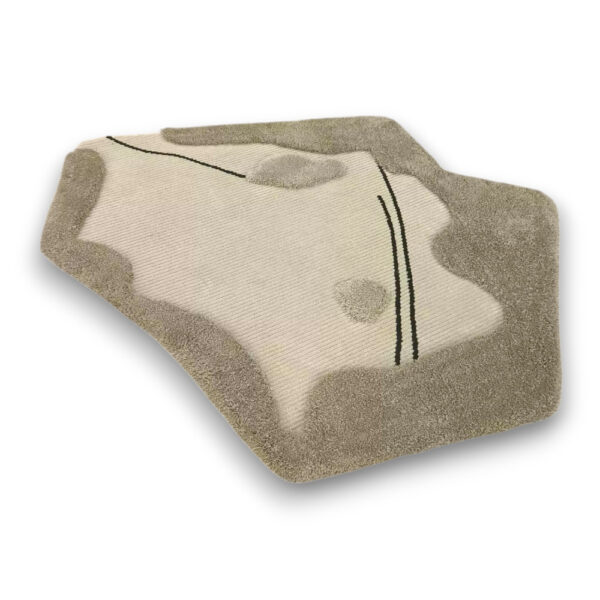 Custom hand-tufted shaggy wool rug in irregular organic shape with cream ribbed center and taupe shaggy border with black accent lines