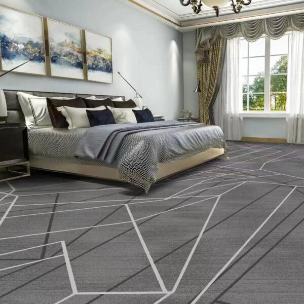 Custom printed large rectangular nylon rug in grey with white geometric line pattern placed in elegant bedroom with modern platform bed