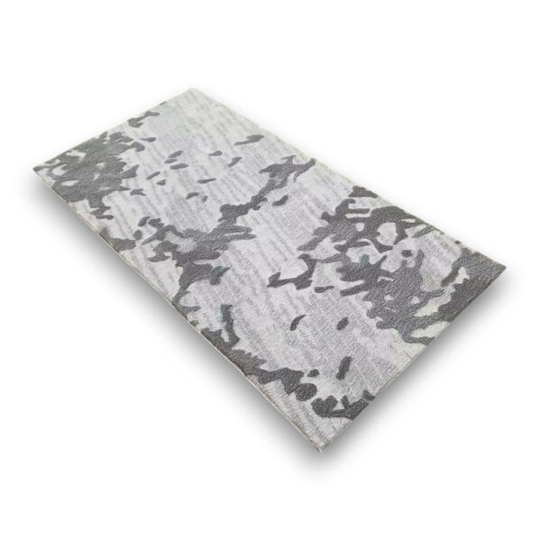 Custom hand-tufted rectangular wool rug in grey and white with abstract camouflage pattern