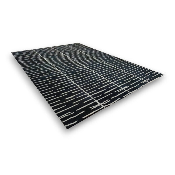 Custom hand-tufted rectangular rug in black with white irregular horizontal lines and geometric grid overlay