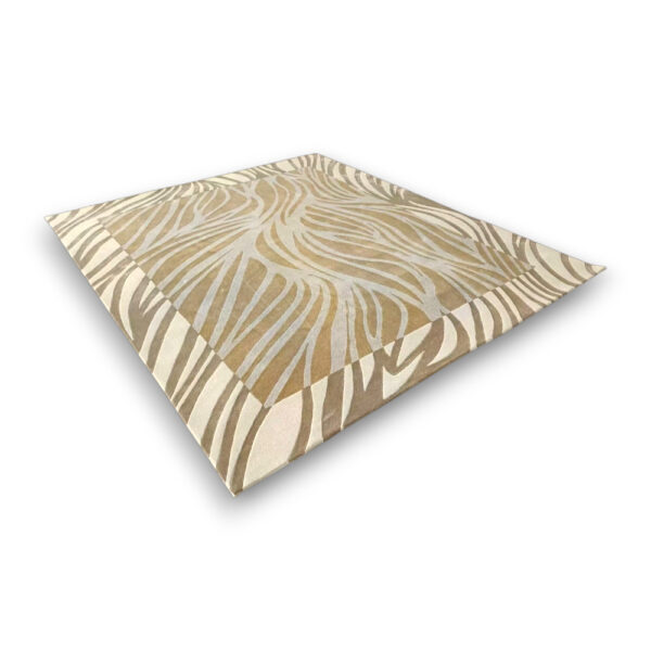 Custom hand-tufted rectangular rug in cream and tan with flowing zebra stripe pattern