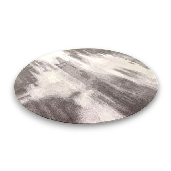 Custom tufted round rug in grey and beige with abstract flowing pattern and modern design