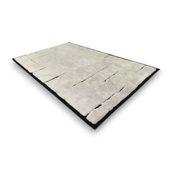 Custom hand-tufted rectangular wool rug in light grey with geometric block pattern and black border