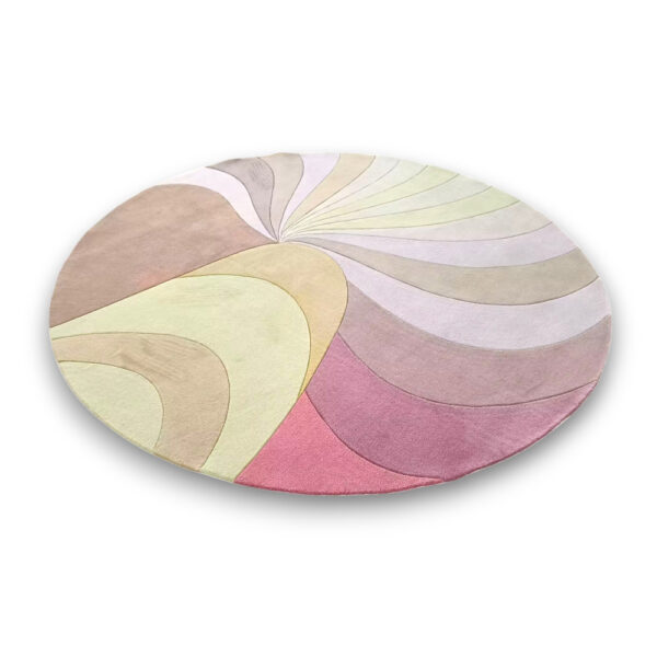 Custom tufted round rug with swirling pattern in pastel colors including pink, green, yellow and beige