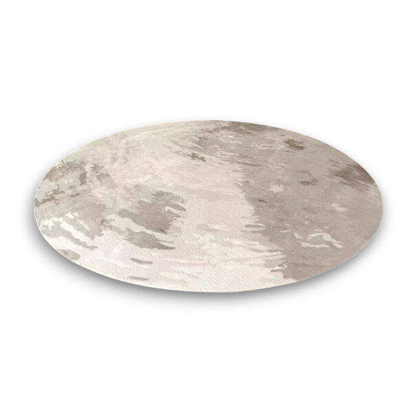 Custom tufted round rug in neutral beige and taupe with subtle abstract cloud-like pattern