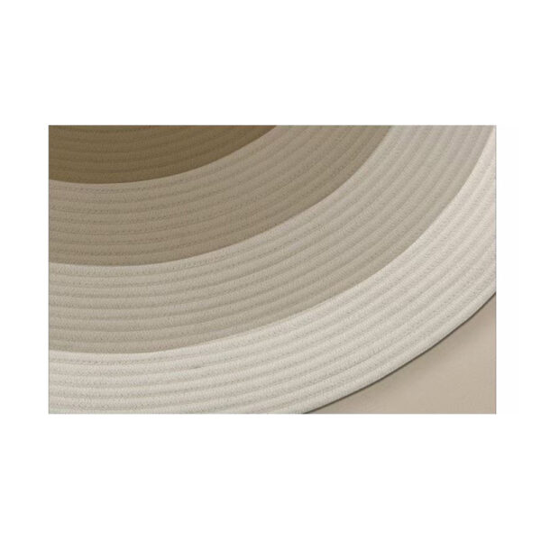 Custom gluefree woven round wool rug showing cream and brown concentric circle pattern with curved border