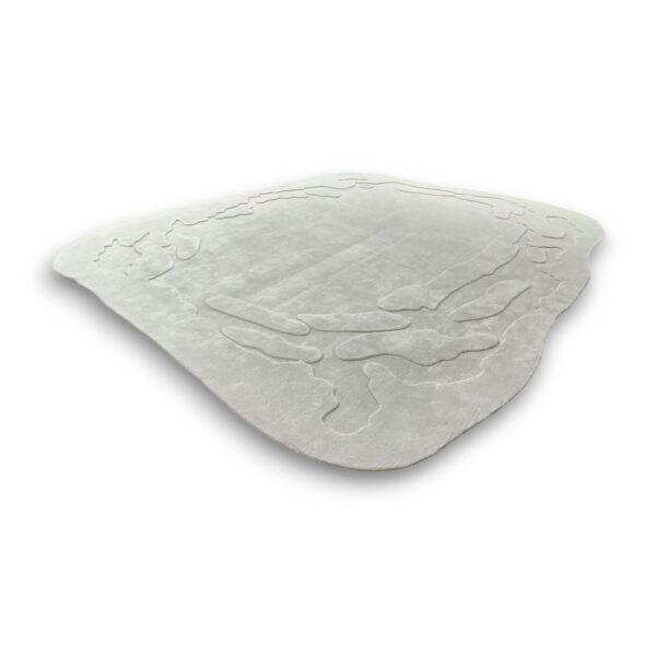 Custom hand-tufted minimalist wool rug in light grey with raised abstract organic pattern and curved border design