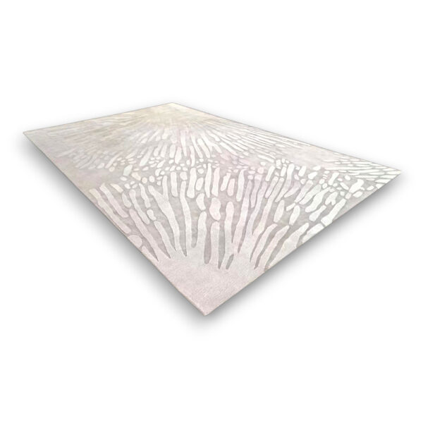 Custom tufted wool rug in blush pink and cream with abstract radiating pattern, rectangular shape, medium pile height