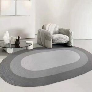 Custom woven gluefree oval wool rug in grey and white with concentric oval pattern placed in modern living room