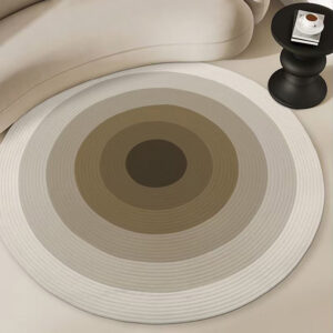 Custom gluefree woven round wool rug in cream and brown concentric circles placed in modern living room next to curved beige sofa