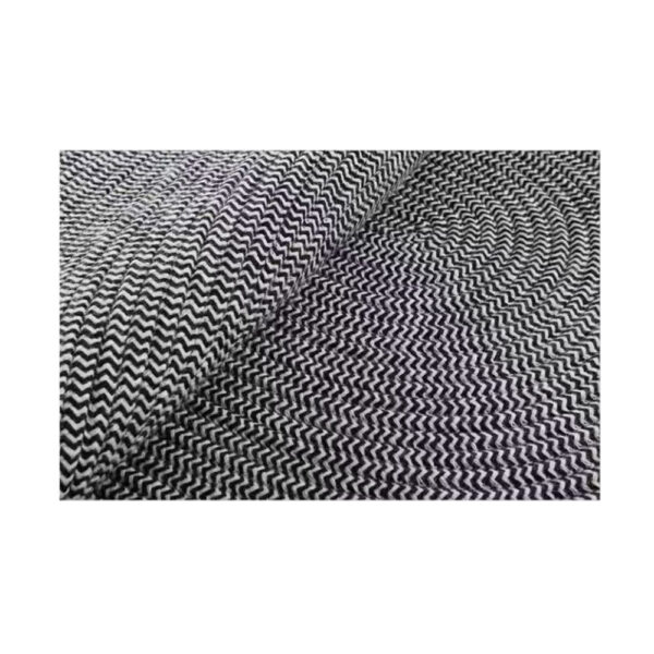 Custom woven gluefree wool rug showing black and white chevron zigzag pattern with visible texture and weave structure