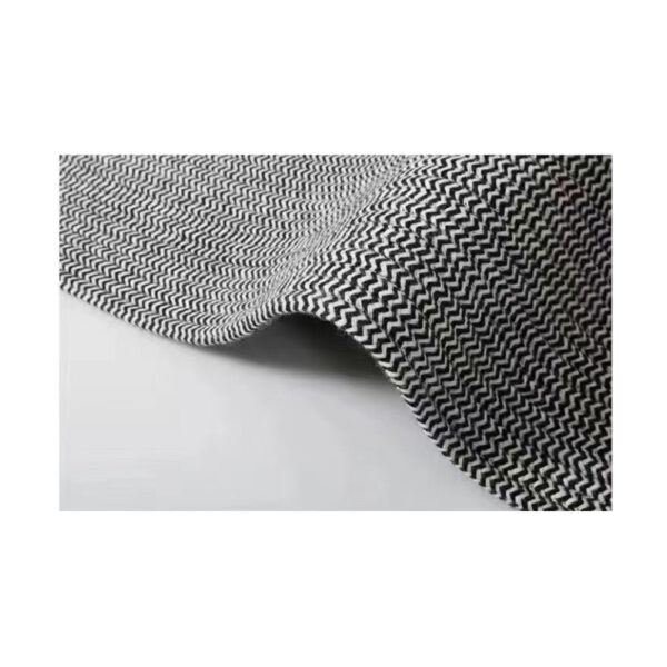 Custom woven gluefree wool rug showing black and white chevron pattern with curved edge and flatweave construction